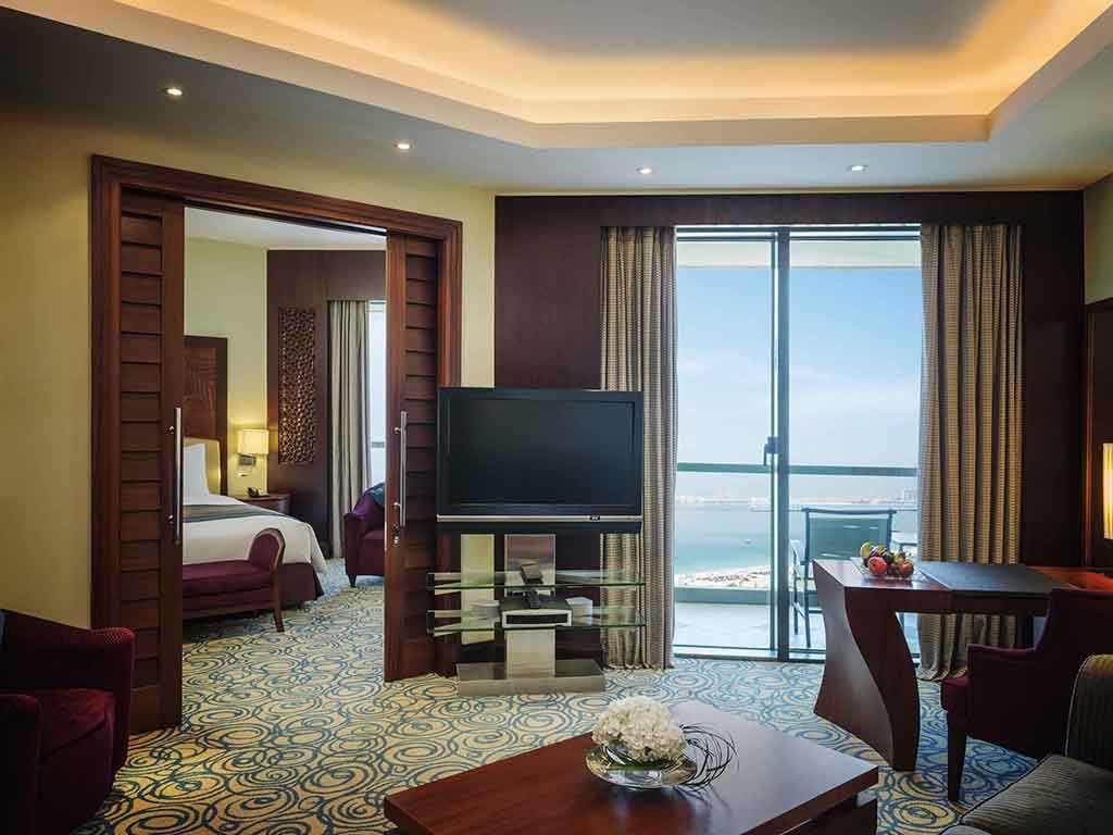 JUNIOR SUITE - PRIVATE BALCONIES, PARTIAL SEA VIEW, SEPARATE SITTING AREA, CLUB LOUNGE ACCESS